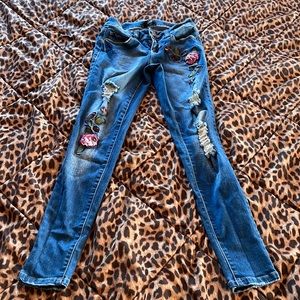 Rose embroidered ripped skinny jeans